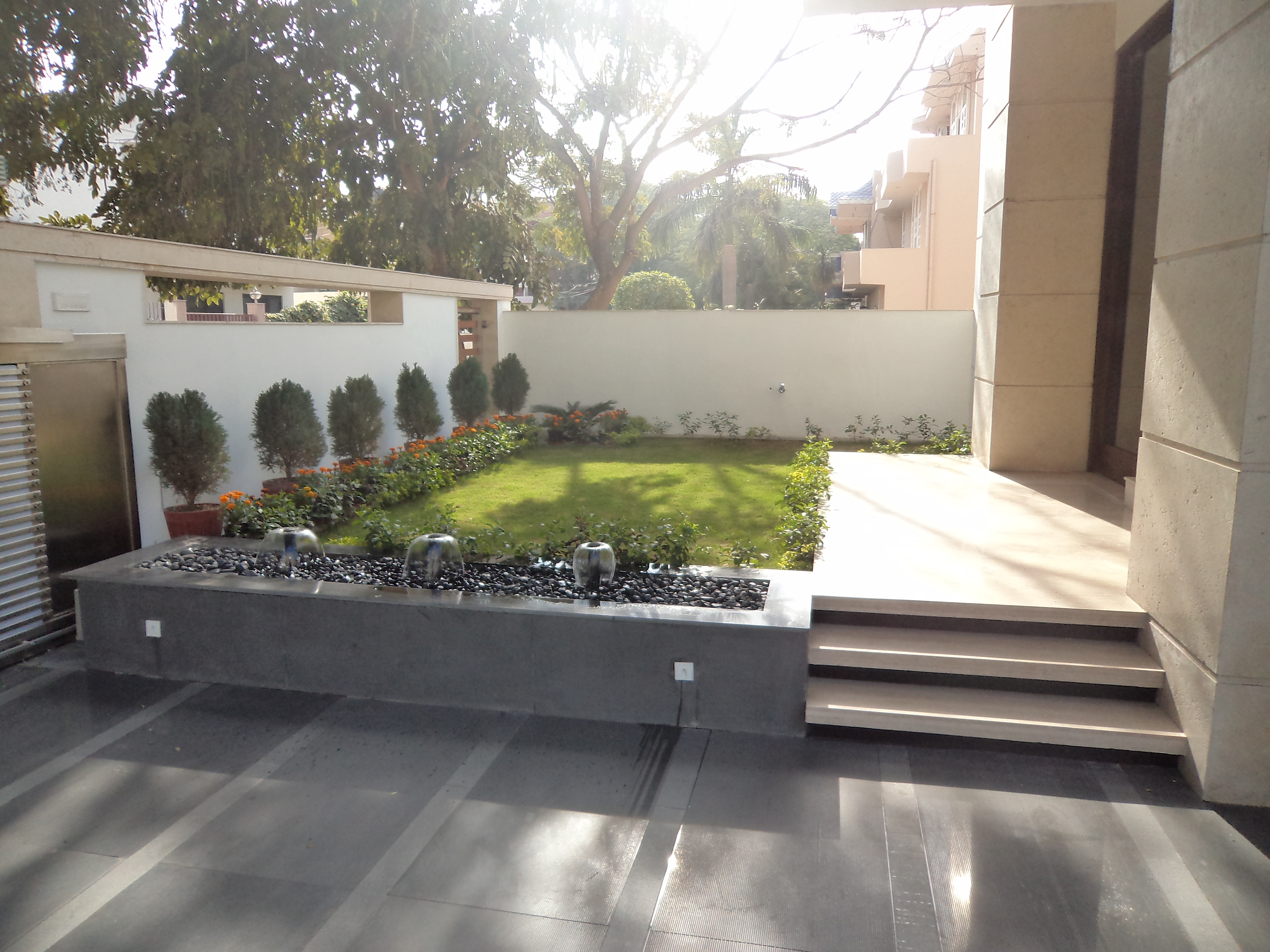 Modern residence with a courtyard garden and water feature